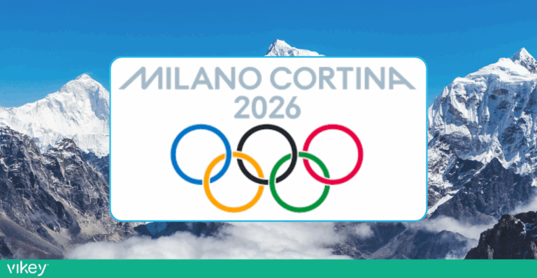 Logo Olimpiadi Invernali Milano-Cortina 2026 con i cinque cerchi olimpici e sfondo montagne innevate
